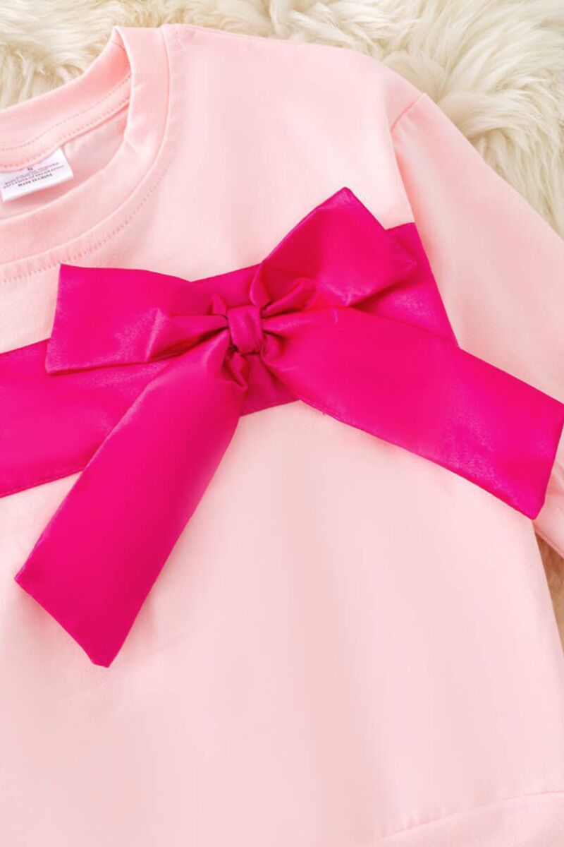 Fuchsia bow on lt. pink sweatshirt. TPG50486
