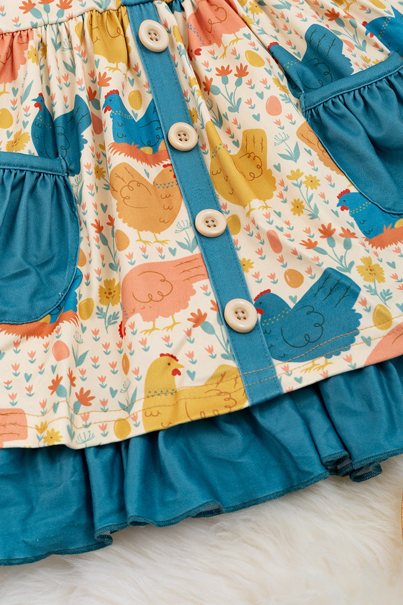 Hen printed dress with teal details