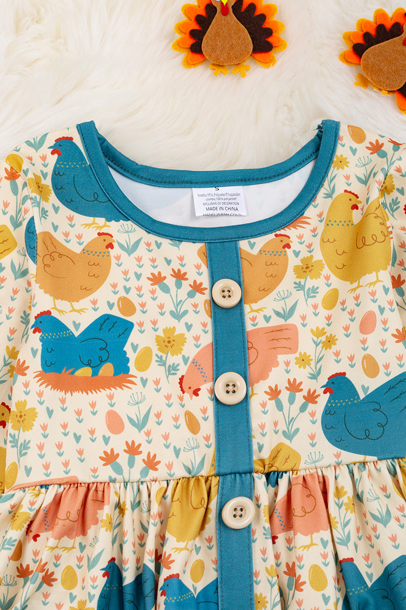 Hen printed dress with teal details
