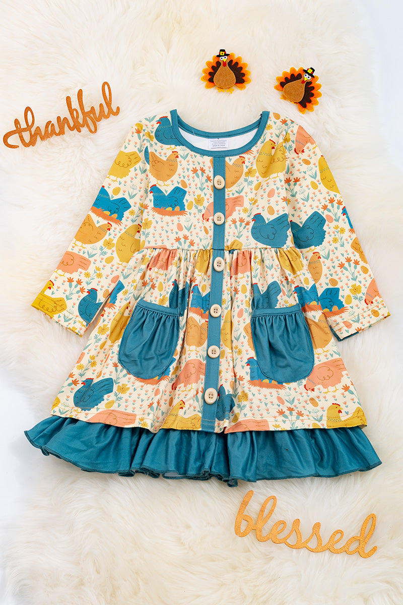Hen printed dress with teal details
