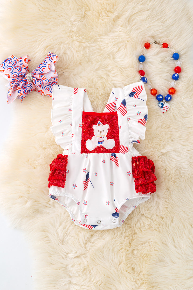 Patriotic teddy bear baby onesie with ruffle butt.