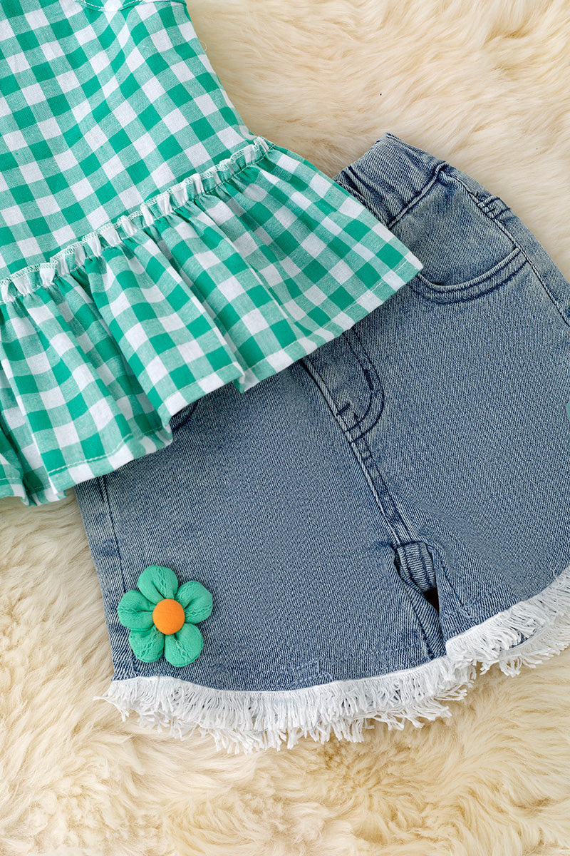 Green gingham ruffle top & denim shorts.