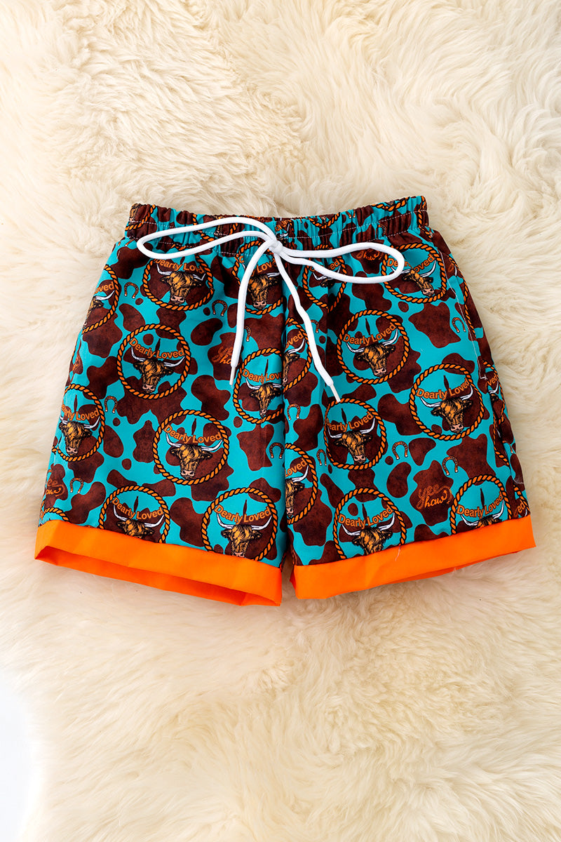 Teal with orange trim boys western trunks.