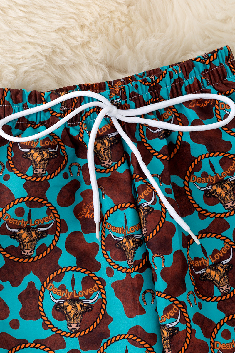 Teal with orange trim boys western trunks.