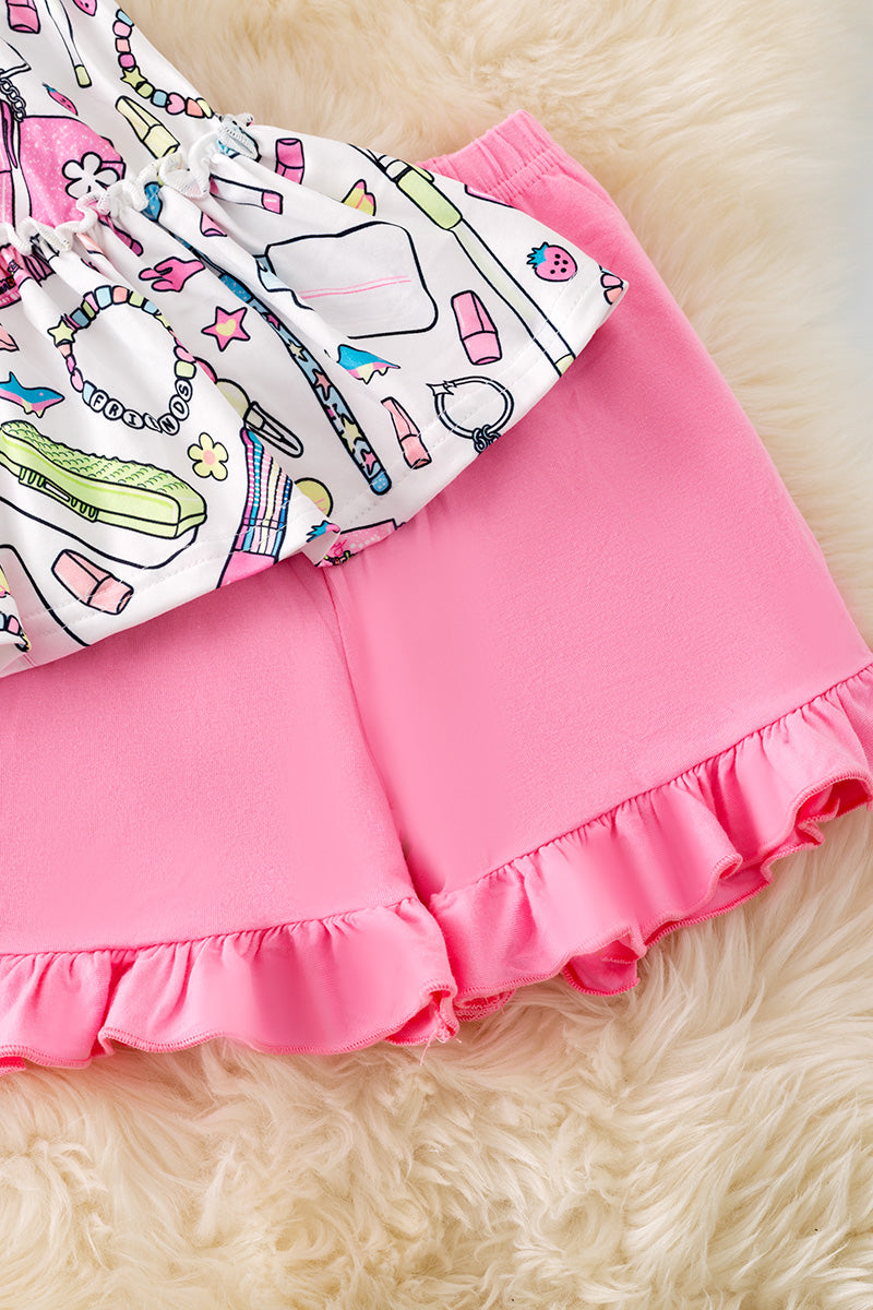 Multi-printed back to school tunic and pink ruffle shorts. OFG50746