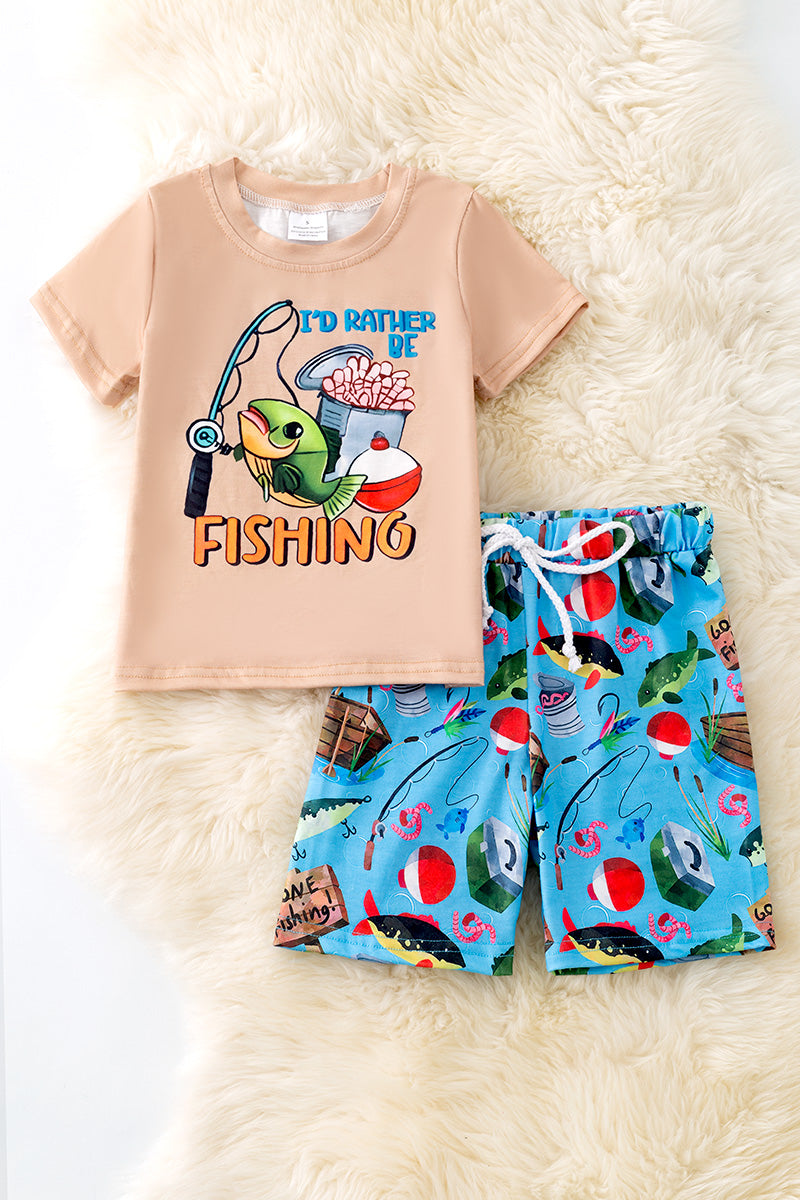 "I'd rather be fishing" Cream tee-shirt and blue fish printed shorts.