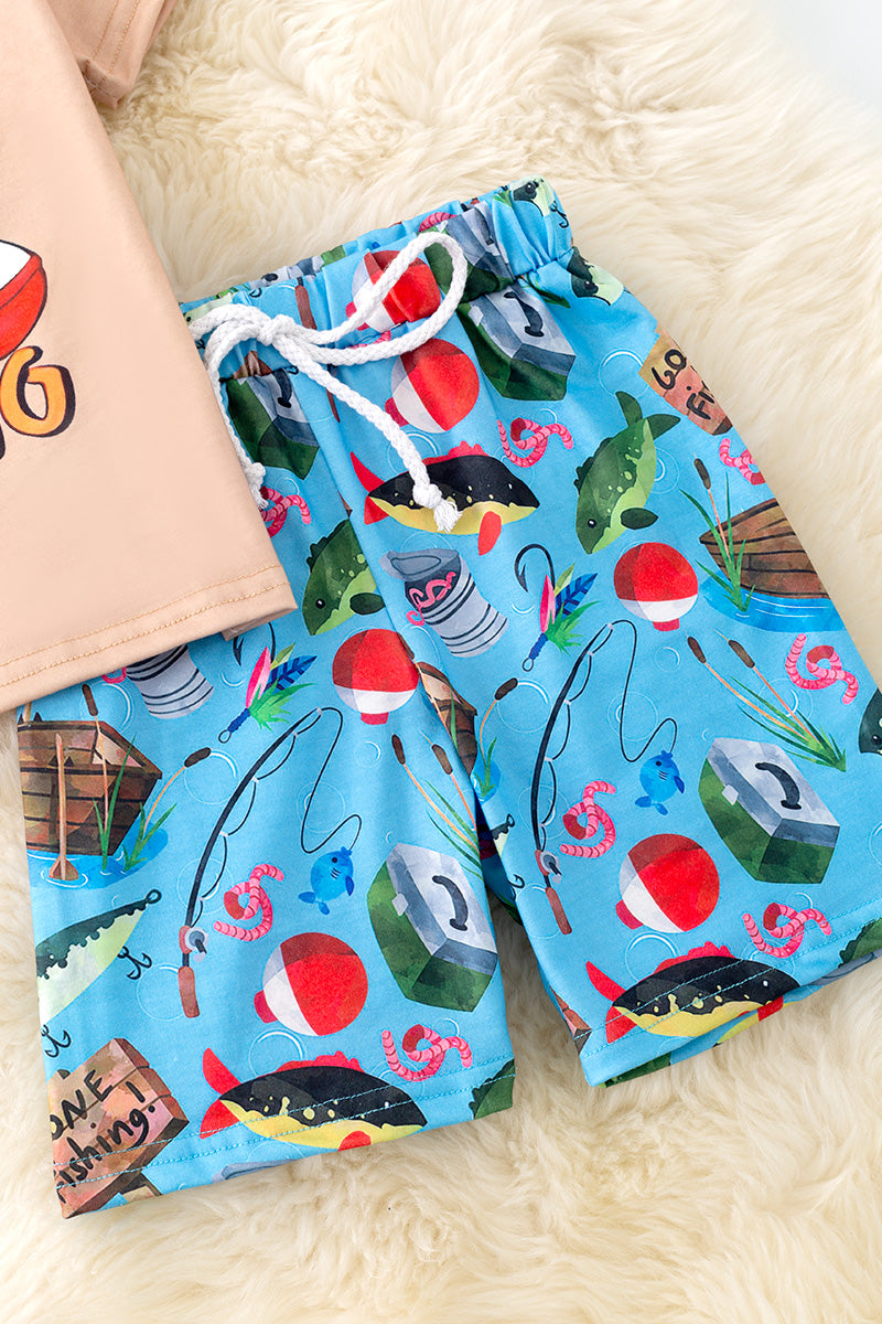"I'd rather be fishing" Cream tee-shirt and blue fish printed shorts.