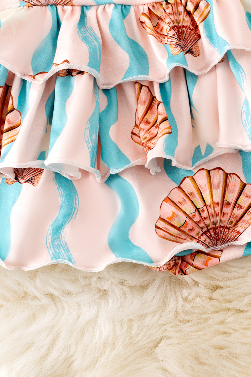Seashell printed girls baby onesie with ruffle layer. RPG50642