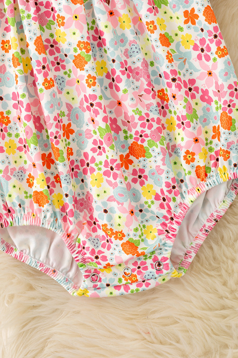 Floral smock baby romper with snaps. RPG62710