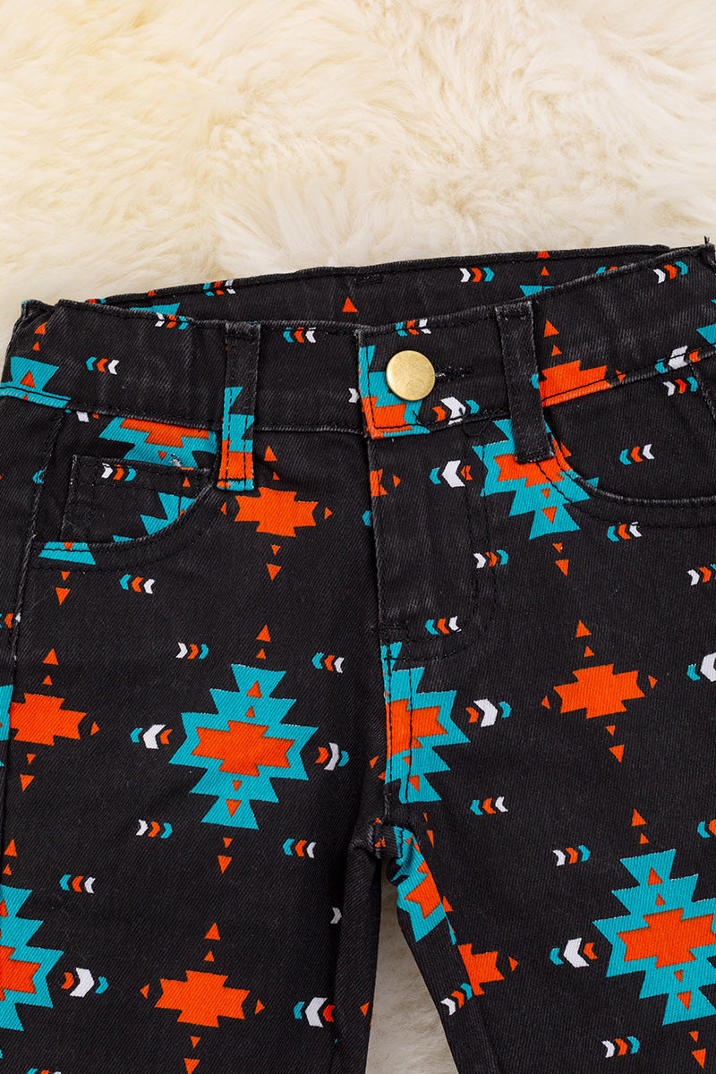 Black Aztec printed boot cut denim pants.