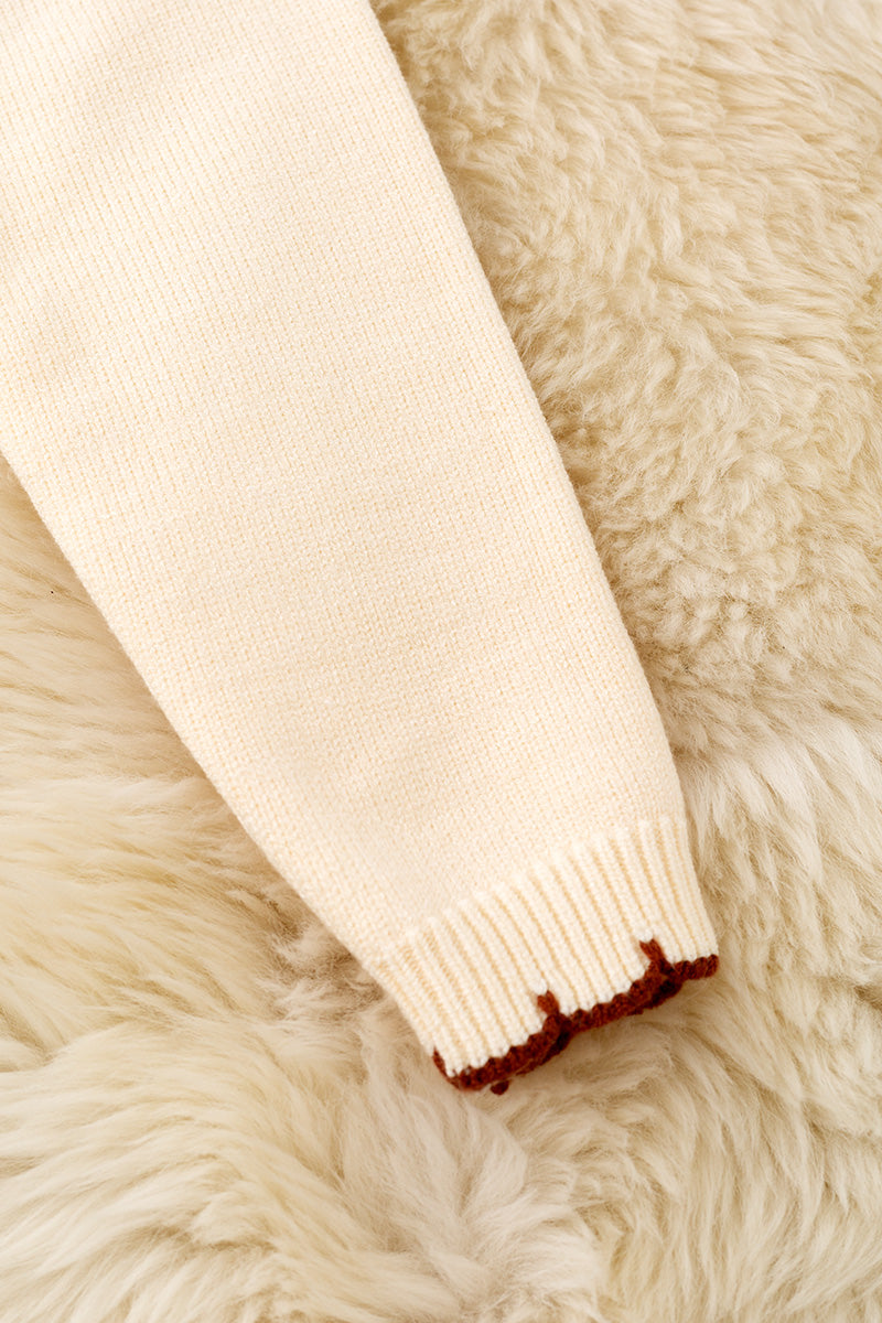 Horse shoe on cream knot pullover sweater w/moon stitch. TPG60491 -S-