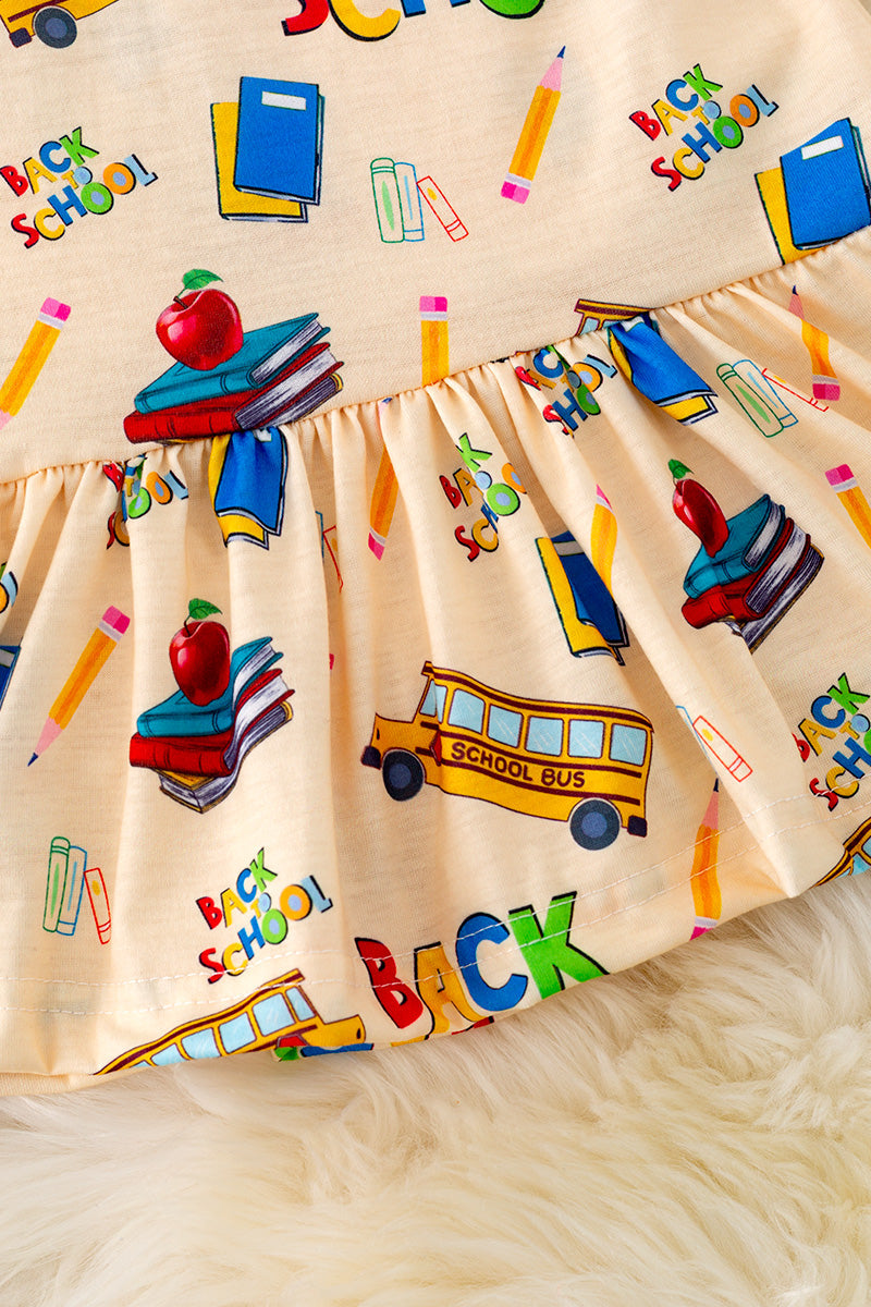 Lt. yellow back to school printed dress.