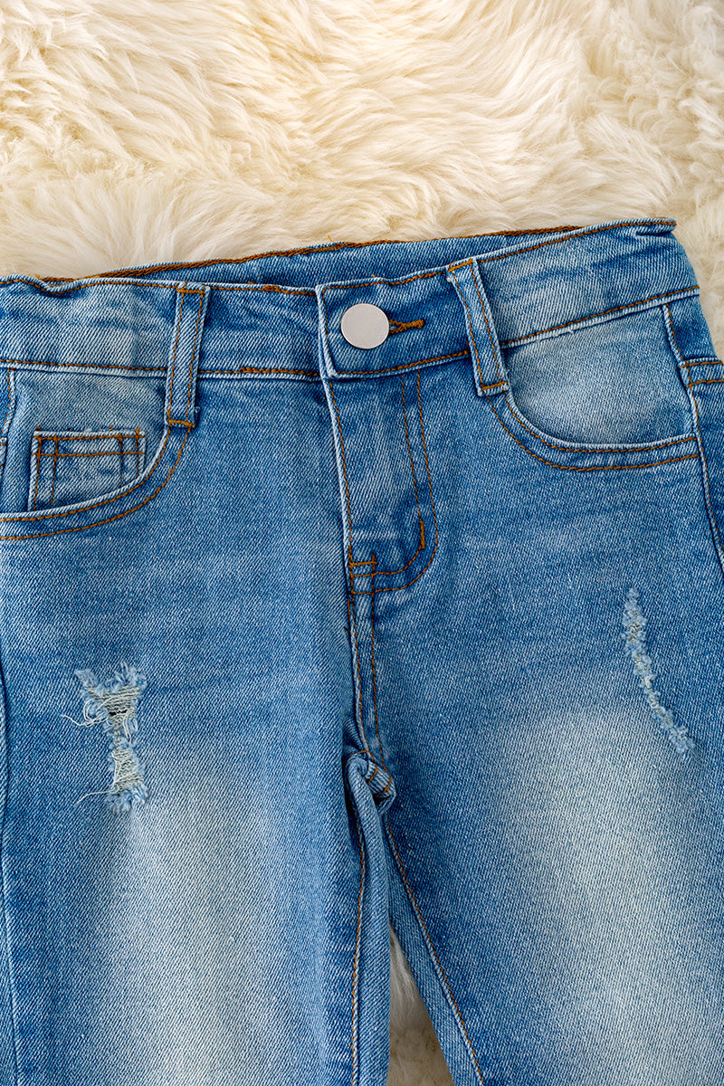 Bleached skinny jeans with distressed hem.