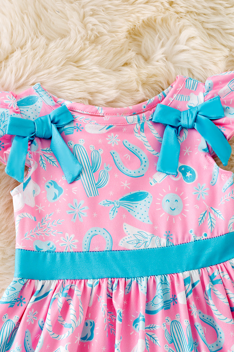 Turquoise and blue western printed girls dress with side bows.