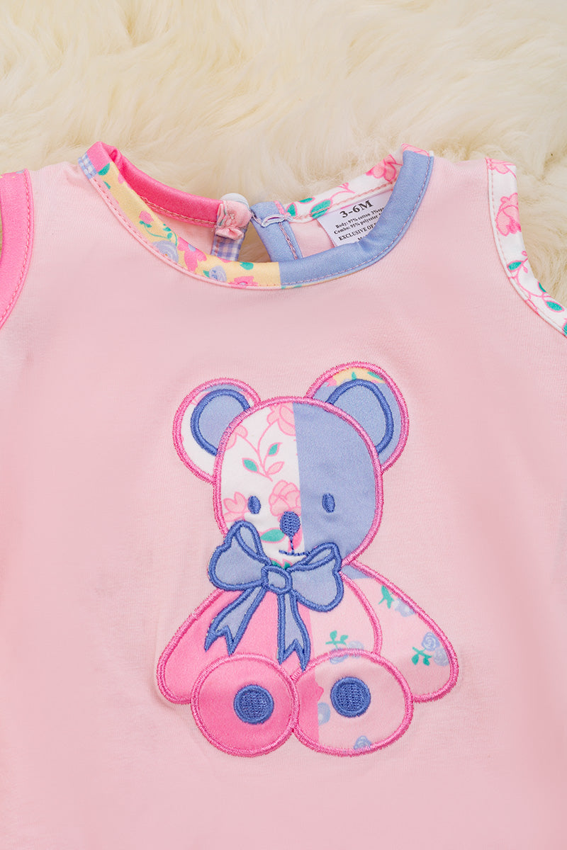 Teddy applique on pink onesie.