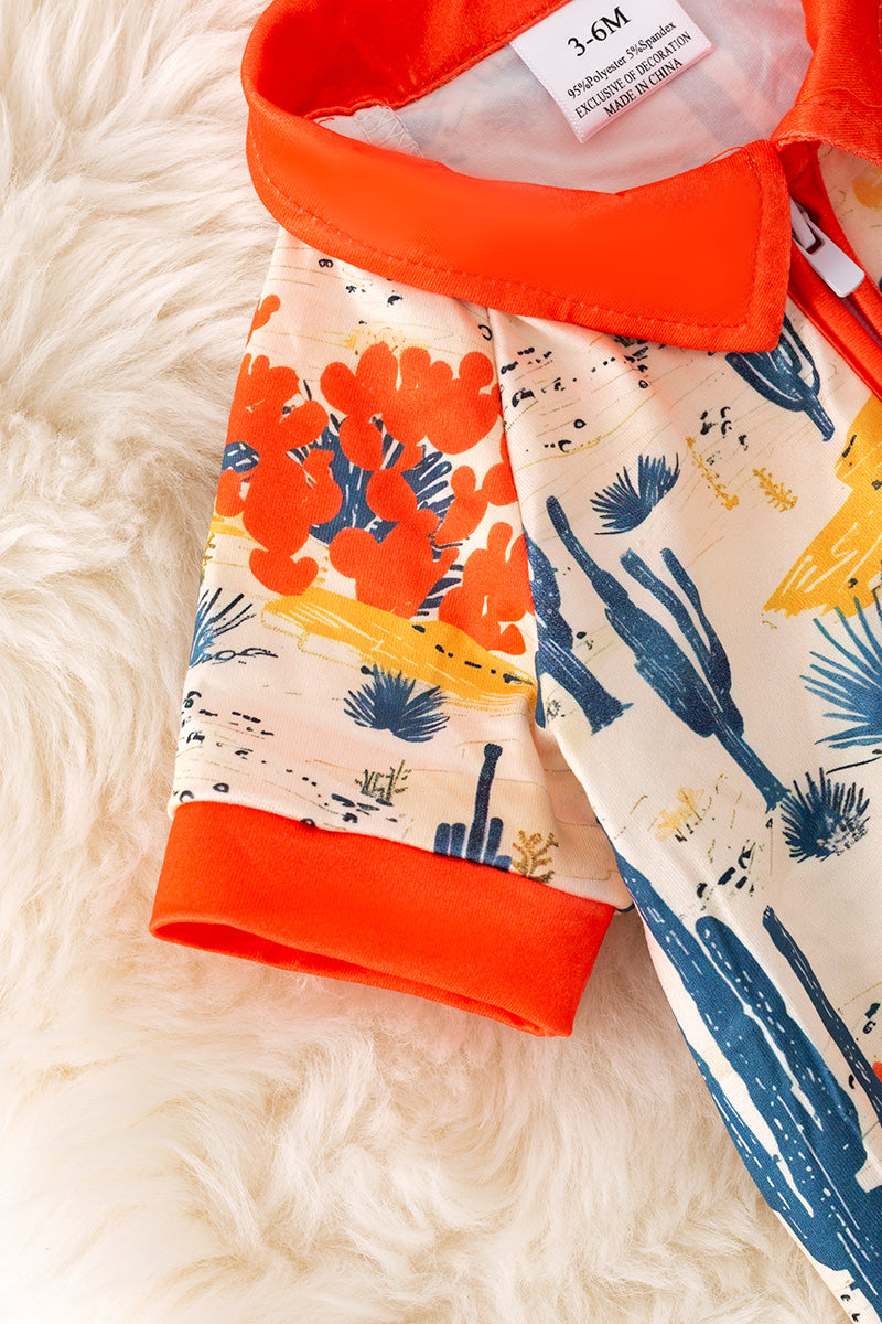 Dry dessert on cream printed baby romper with orange trim. RPB50321