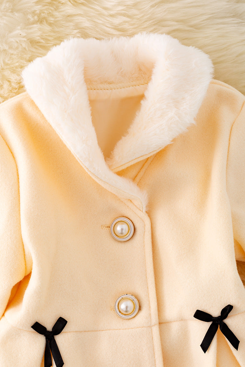 Ivory lined jacket with cozy fur trim.
