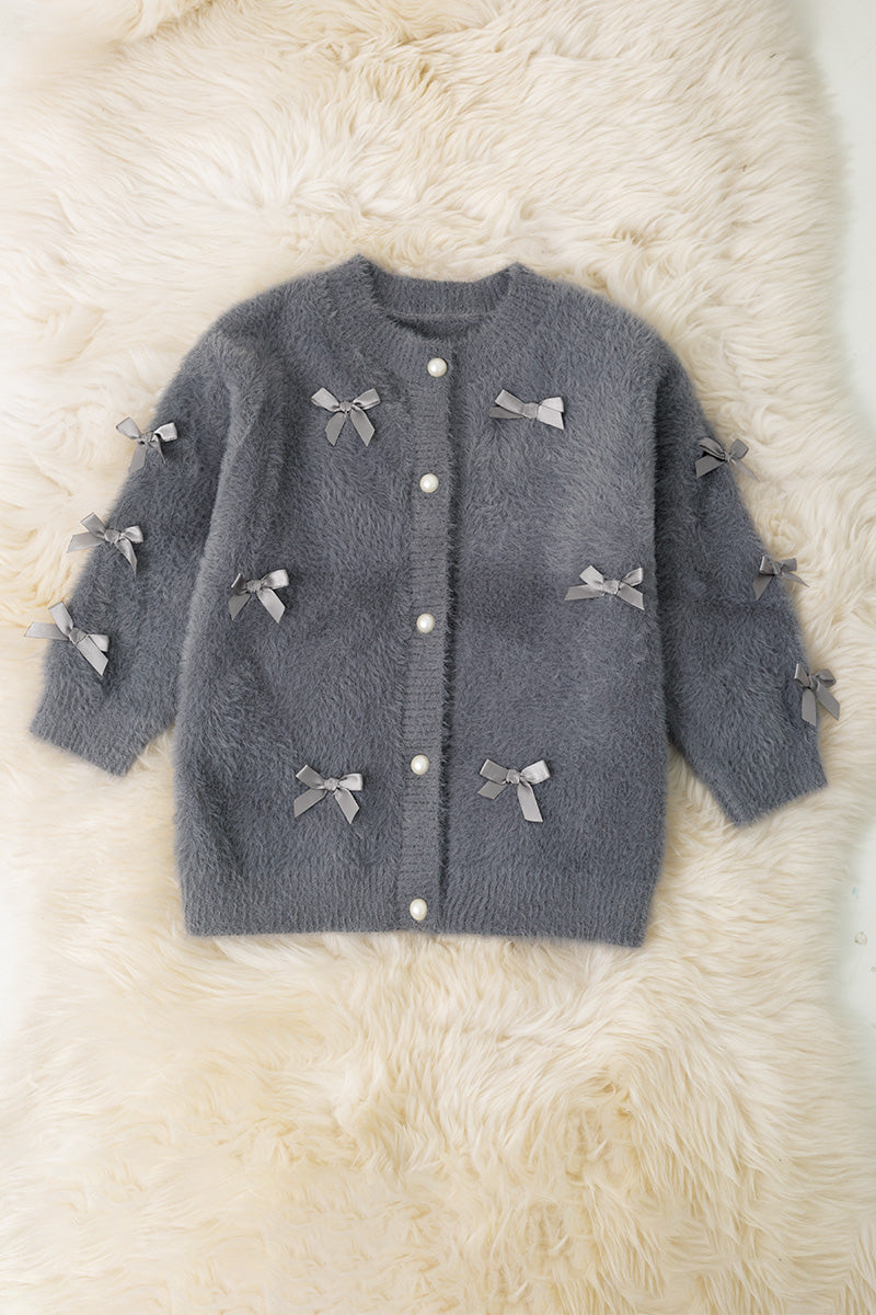 Gray button up cardigan with peal buttons.