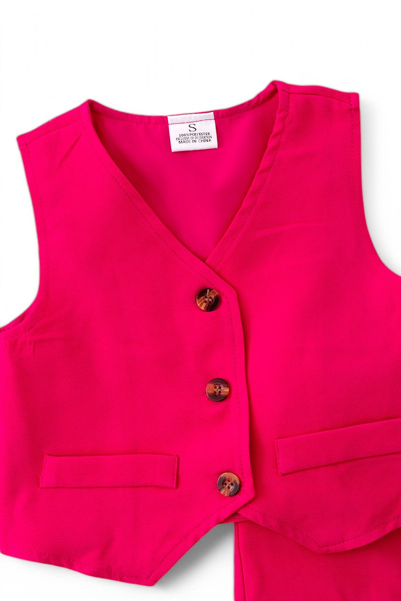 Fuchsia vest with dressy pants.
