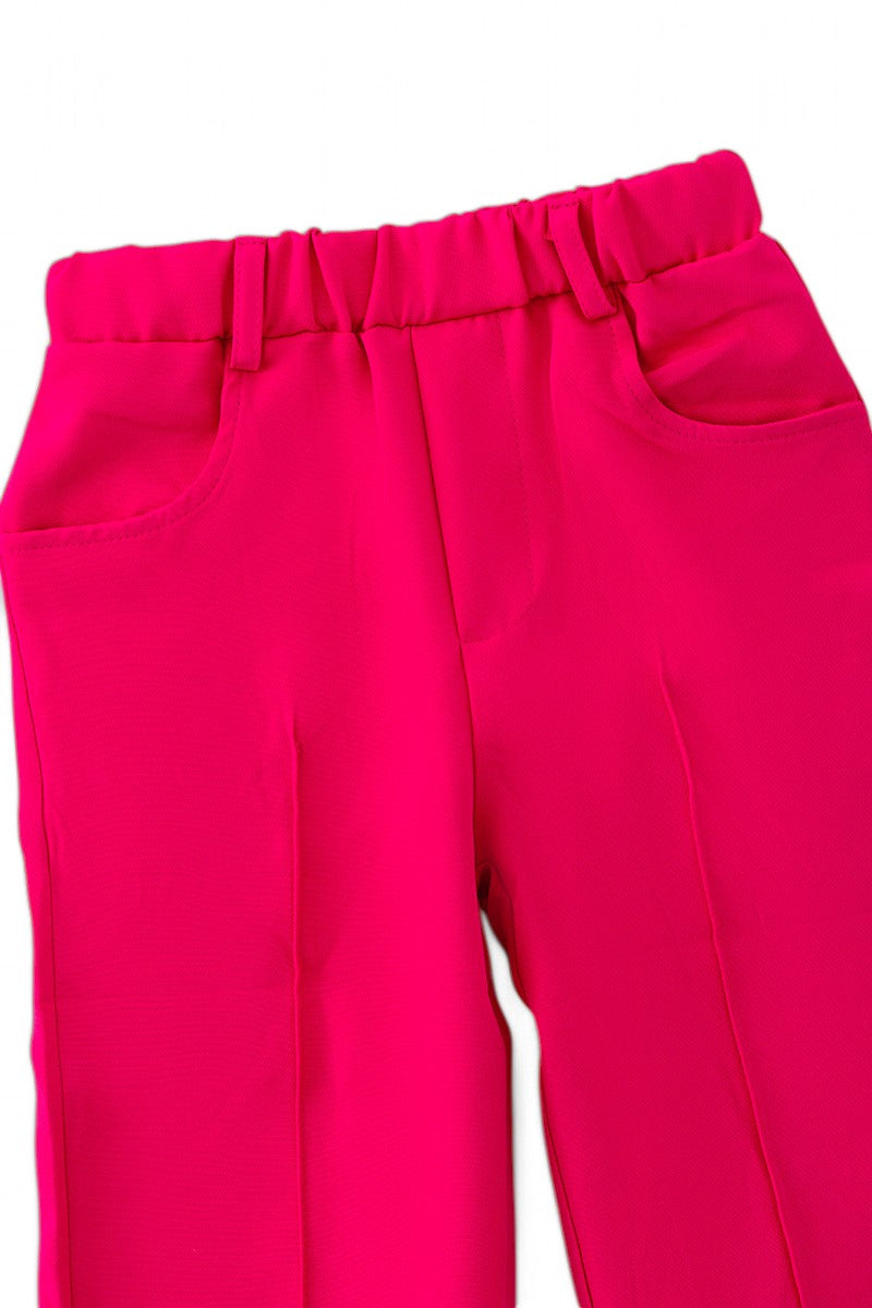 Fuchsia vest with dressy pants.