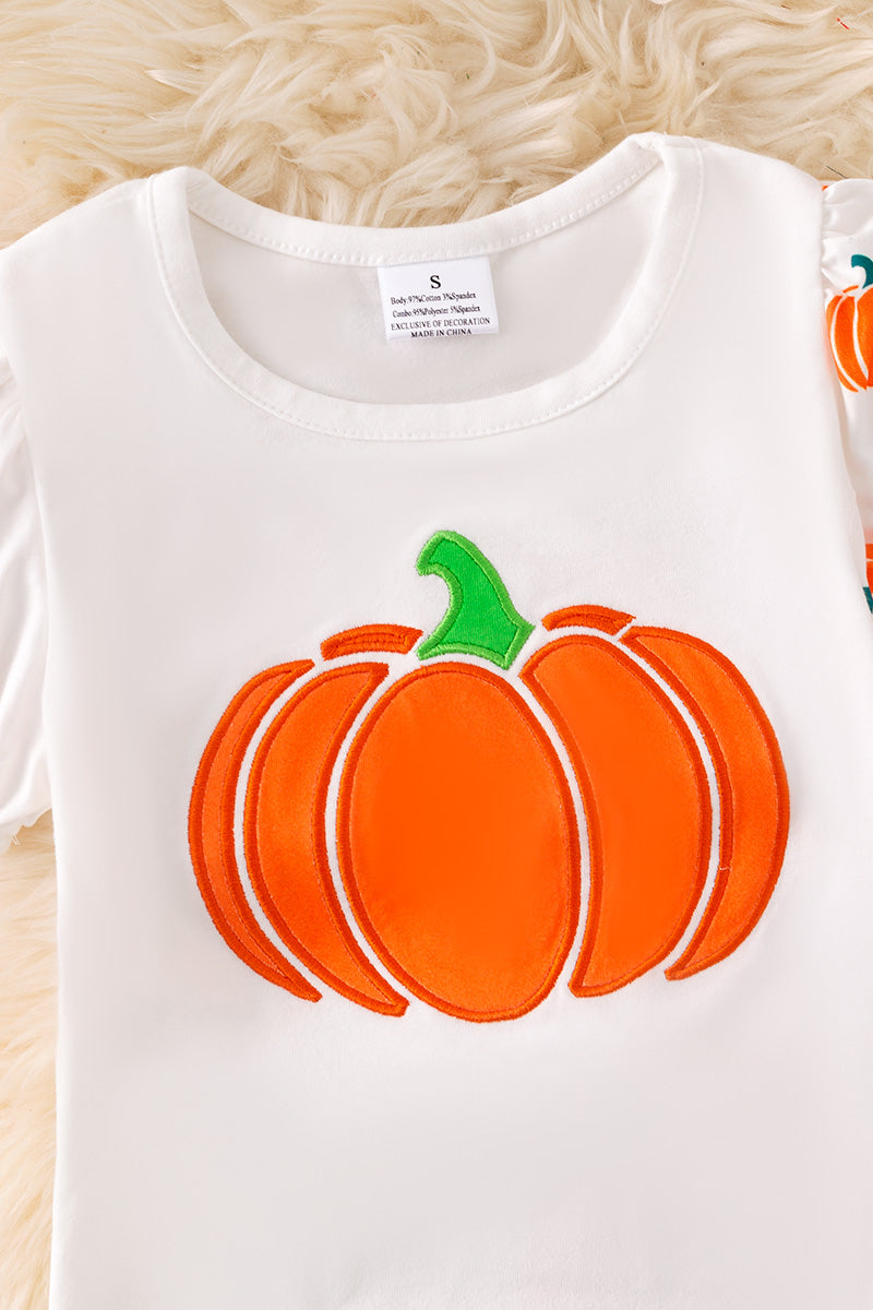 Pumpkin printed top and bell bottoms.