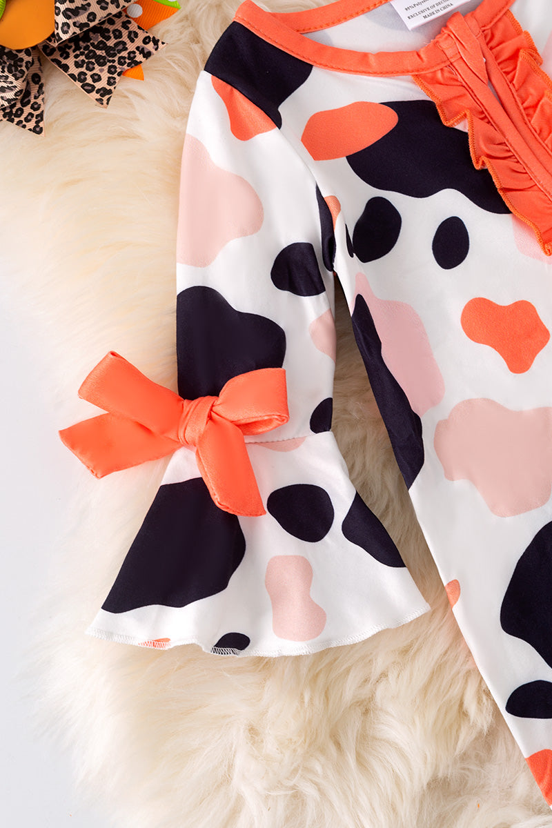 Spotted baby bodysuit with bell sleeves.
