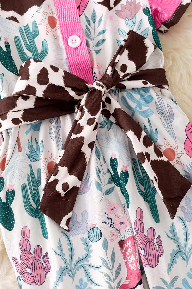 Cow printed and fuchsia trim girls jumpsuit.