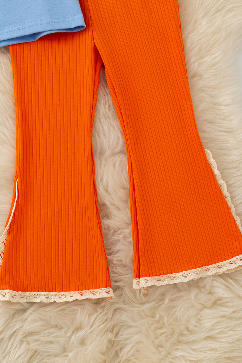 Fall Y'all" Blue ruffle top and orange pants with ivory lace hem. OFG61411