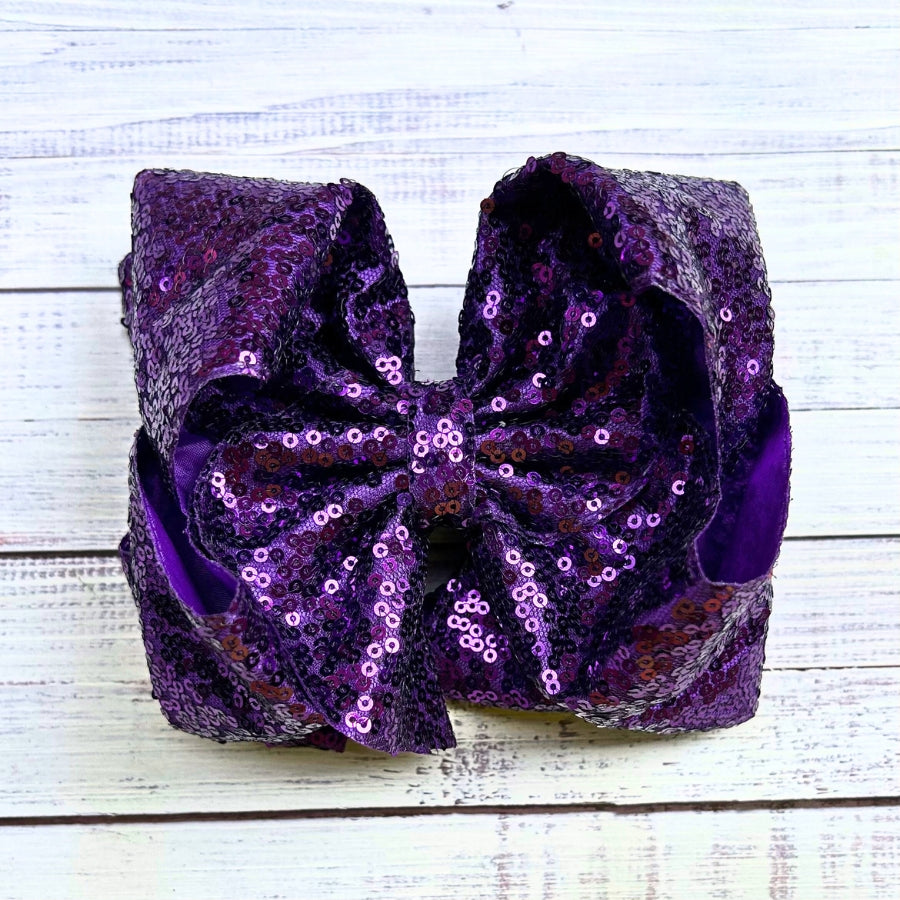 Double layer sequins bows w/alligator clip.