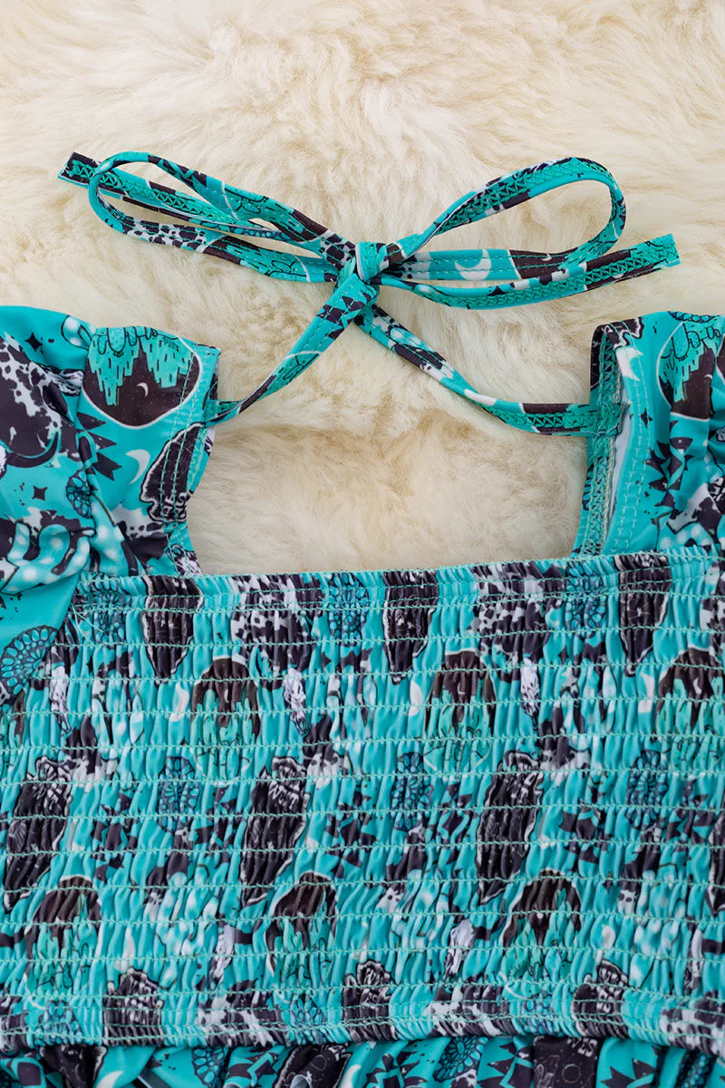 Shield printed bathing set with smocked design and bubble sleeve.