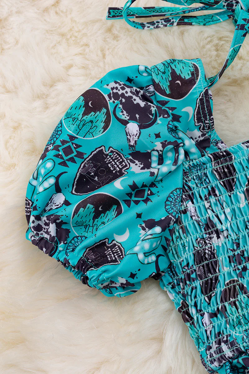 Shield printed bathing set with smocked design and bubble sleeve.