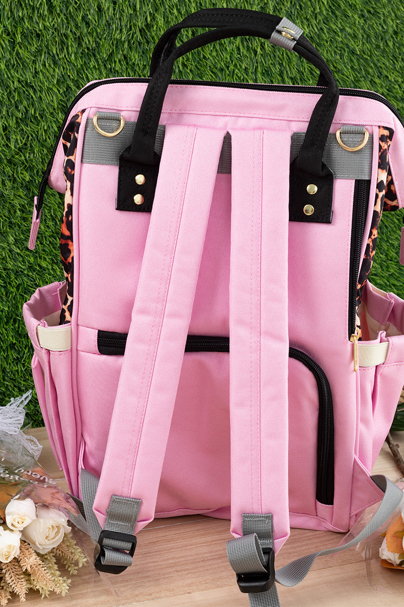 Pink animal printed diaper bag.
