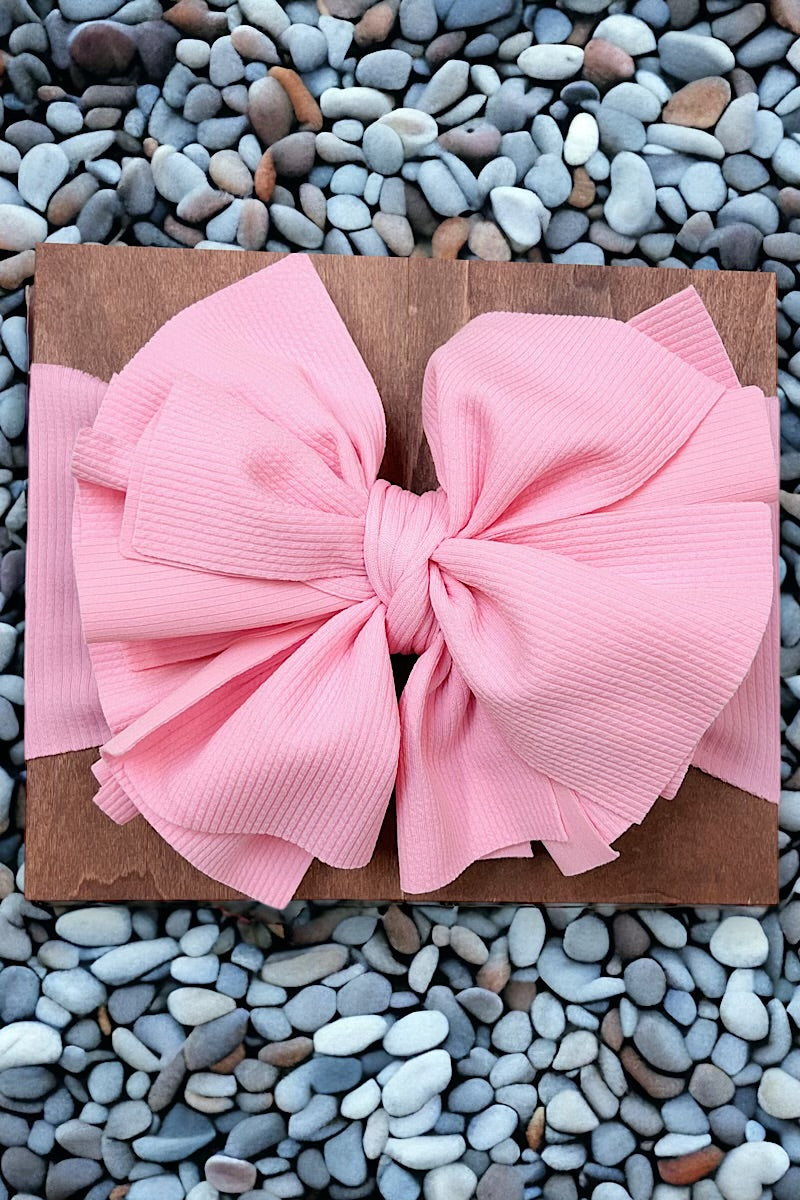 Big tassel ribbed material toddler headband. Available in 3 colors