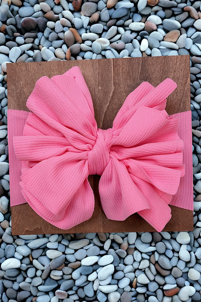Big tassel ribbed material toddler headband. Available in 3 colors