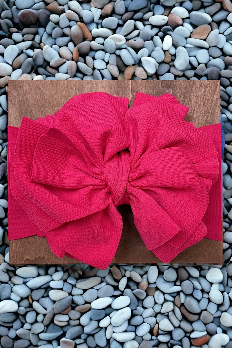 Big tassel ribbed material toddler headband. Available in 3 colors