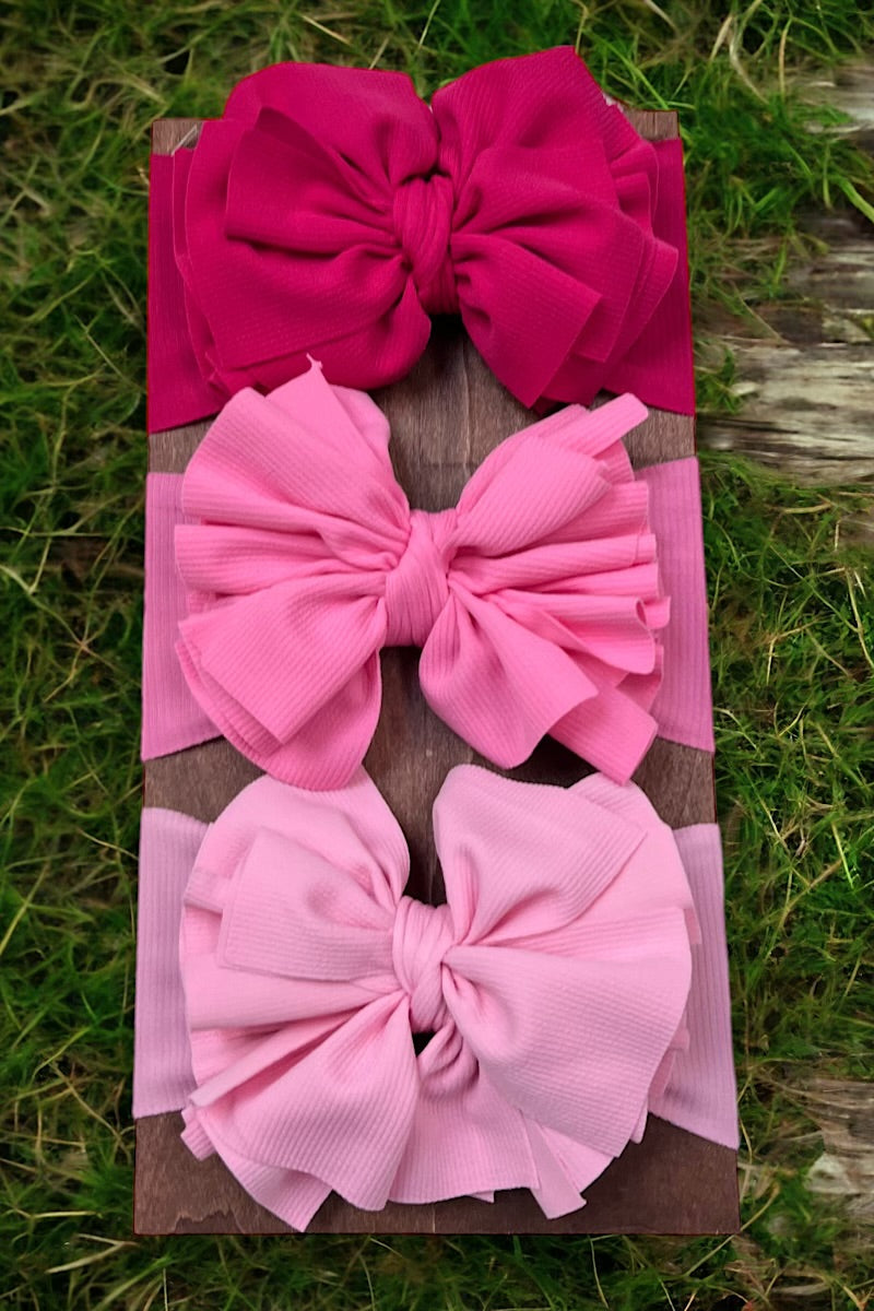 Big tassel ribbed material toddler headband. Available in 3 colors