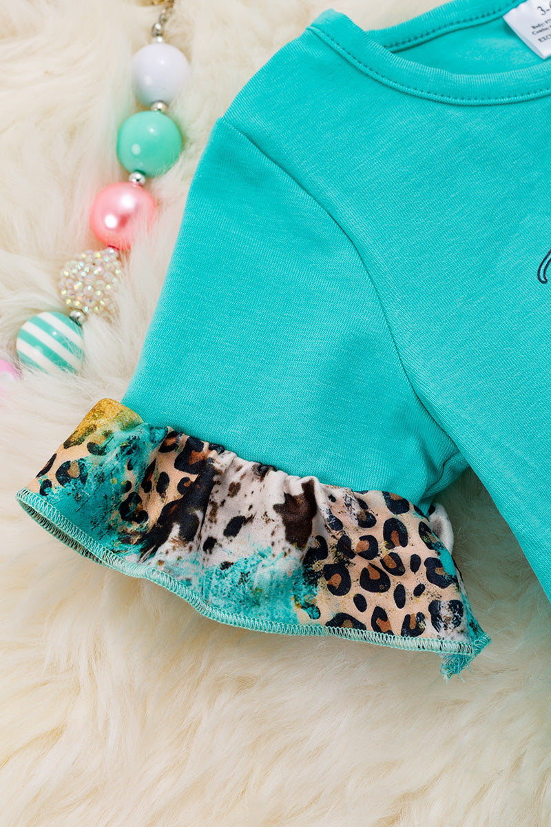"Just a girl who loves pigs" turquoise baby onesie.
