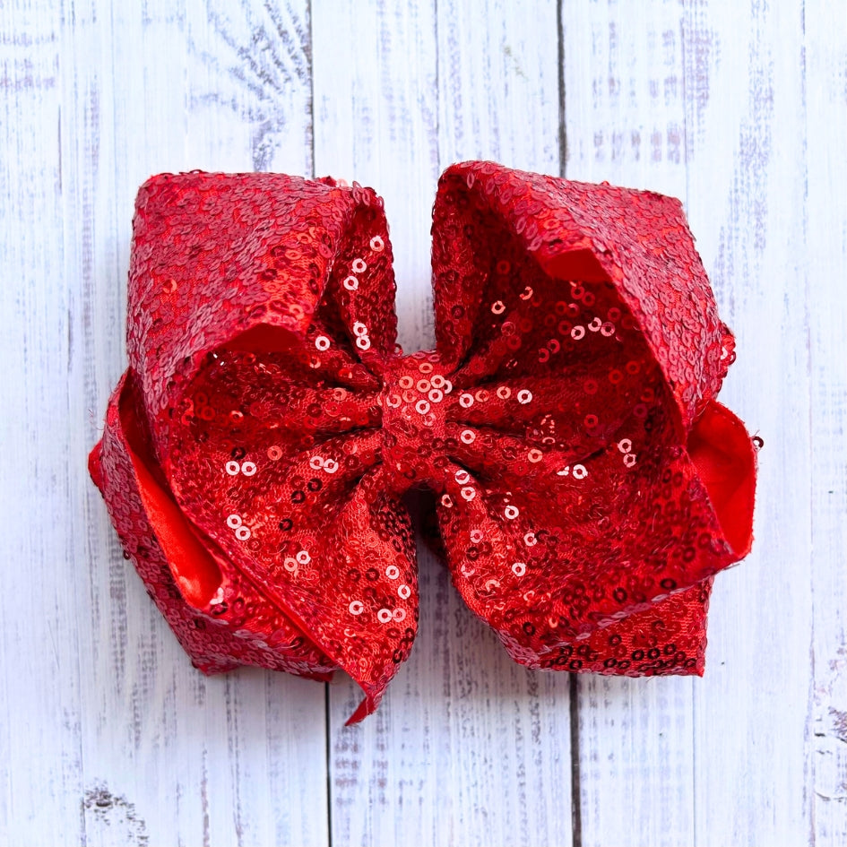 Double layer sequins bows w/alligator clip.