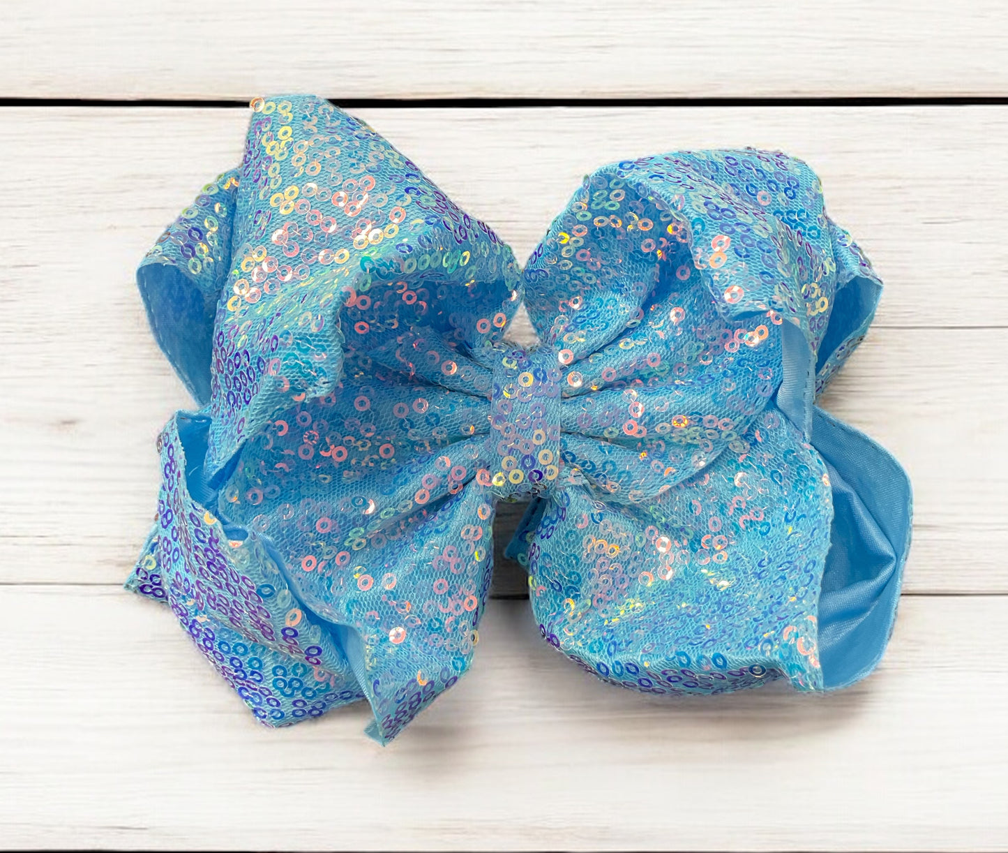 Double layer sequins bows w/alligator clip.