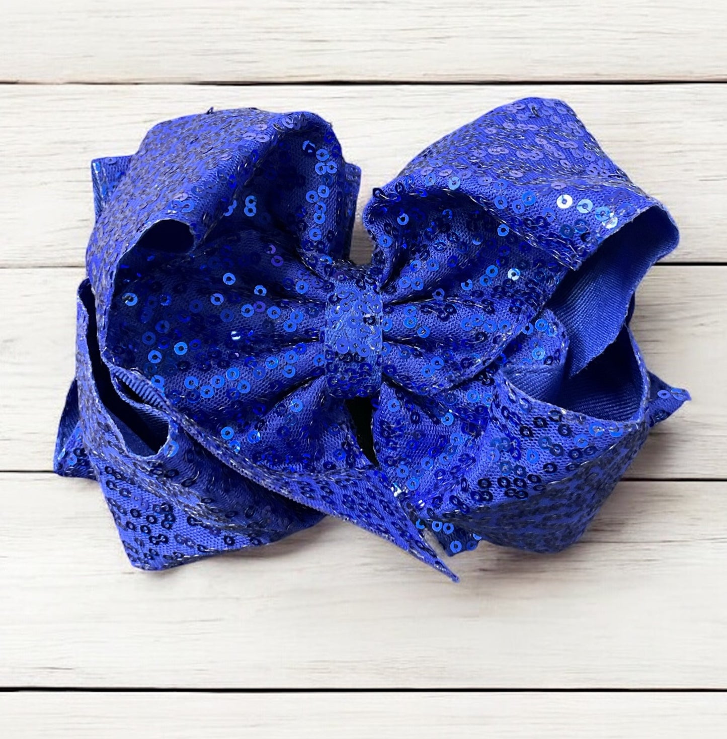 Double layer sequins bows w/alligator clip.
