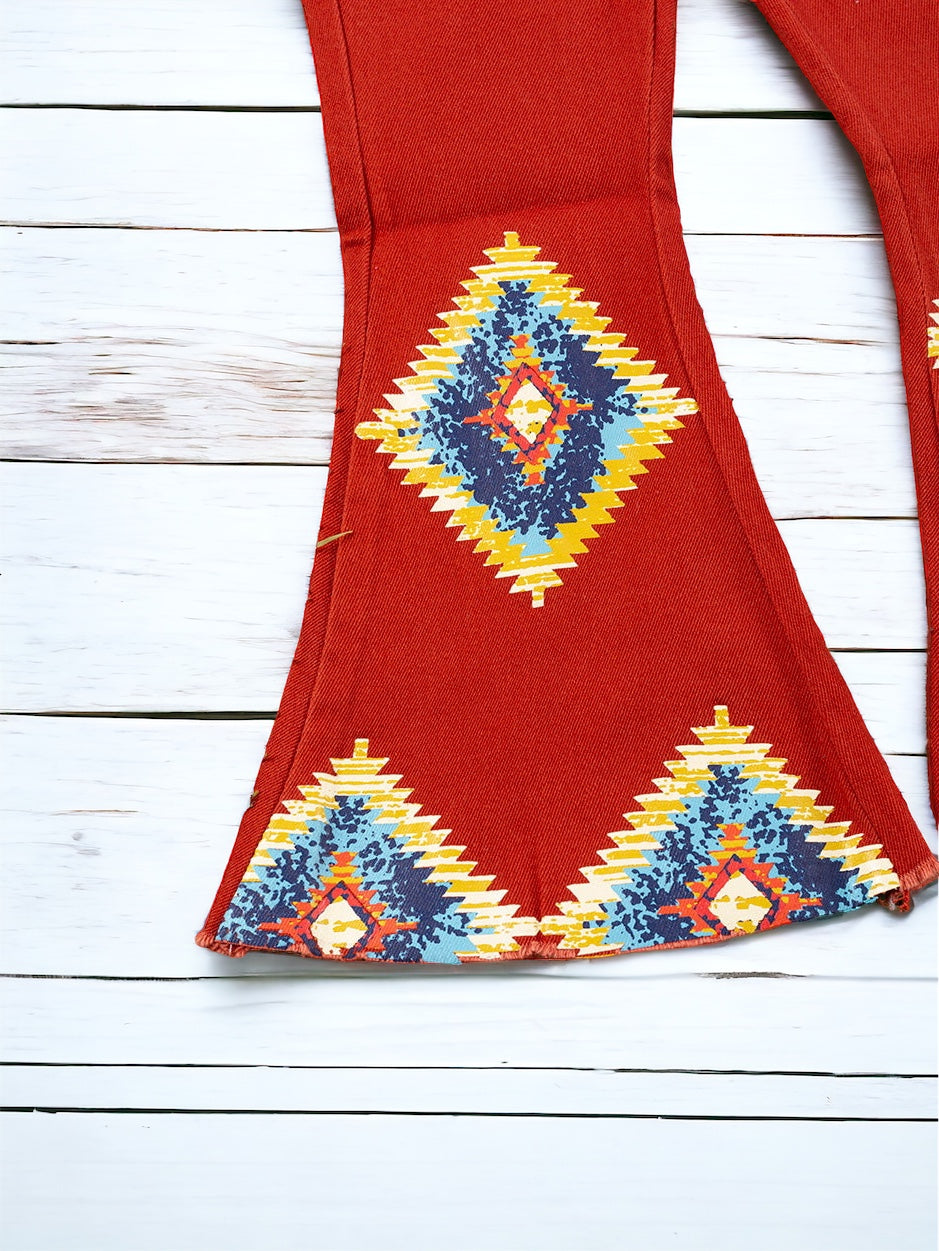 AZTEC ON BURNT ORANGE PRINTED DENIM PANTS FOR GIRLS. PNG65153060