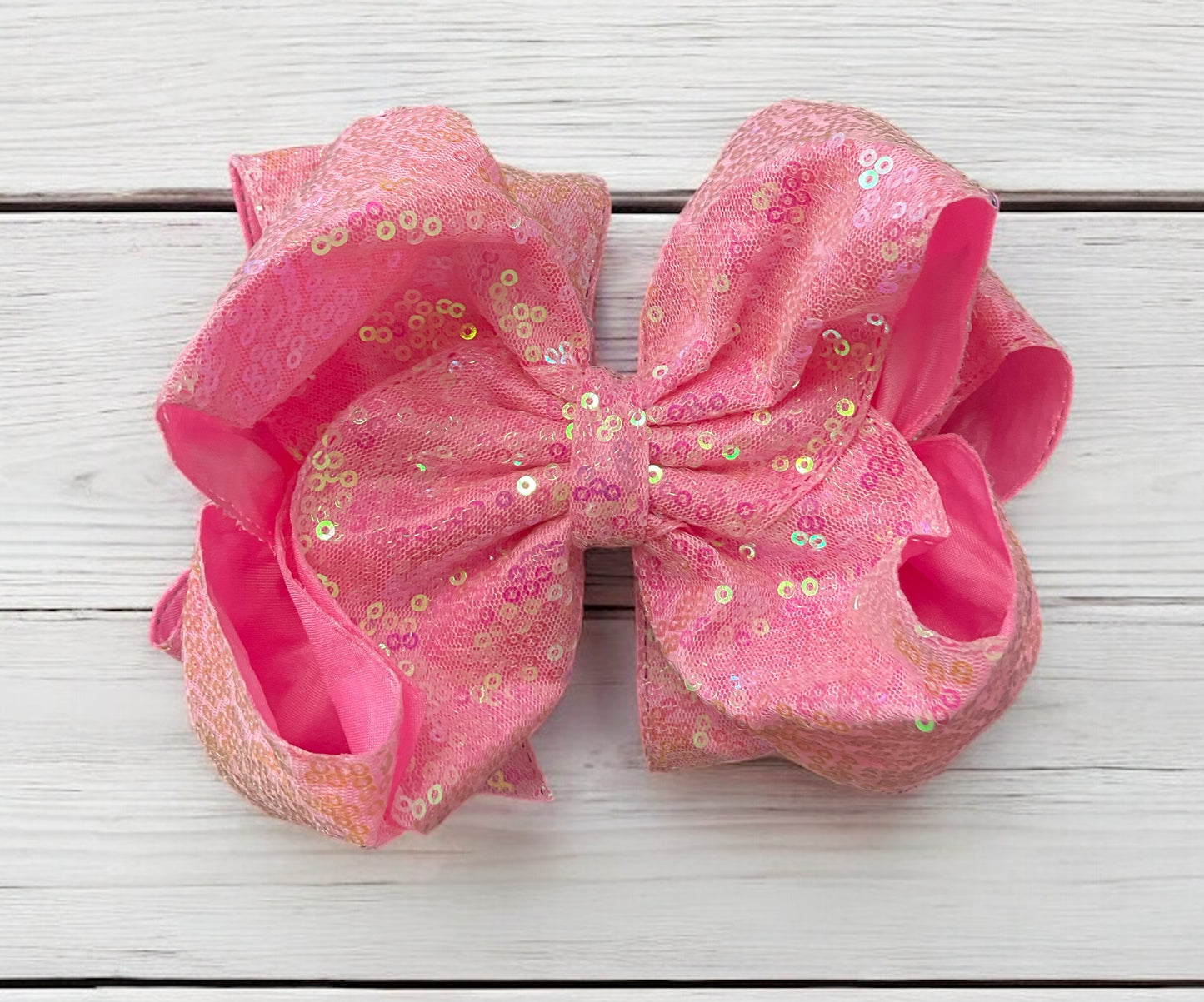 Double layer sequins bows w/alligator clip.