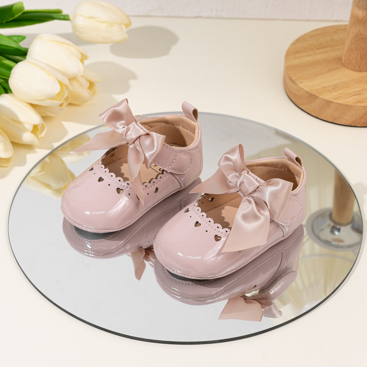 Cute heart pink front satin bow baby shoes. CG5369