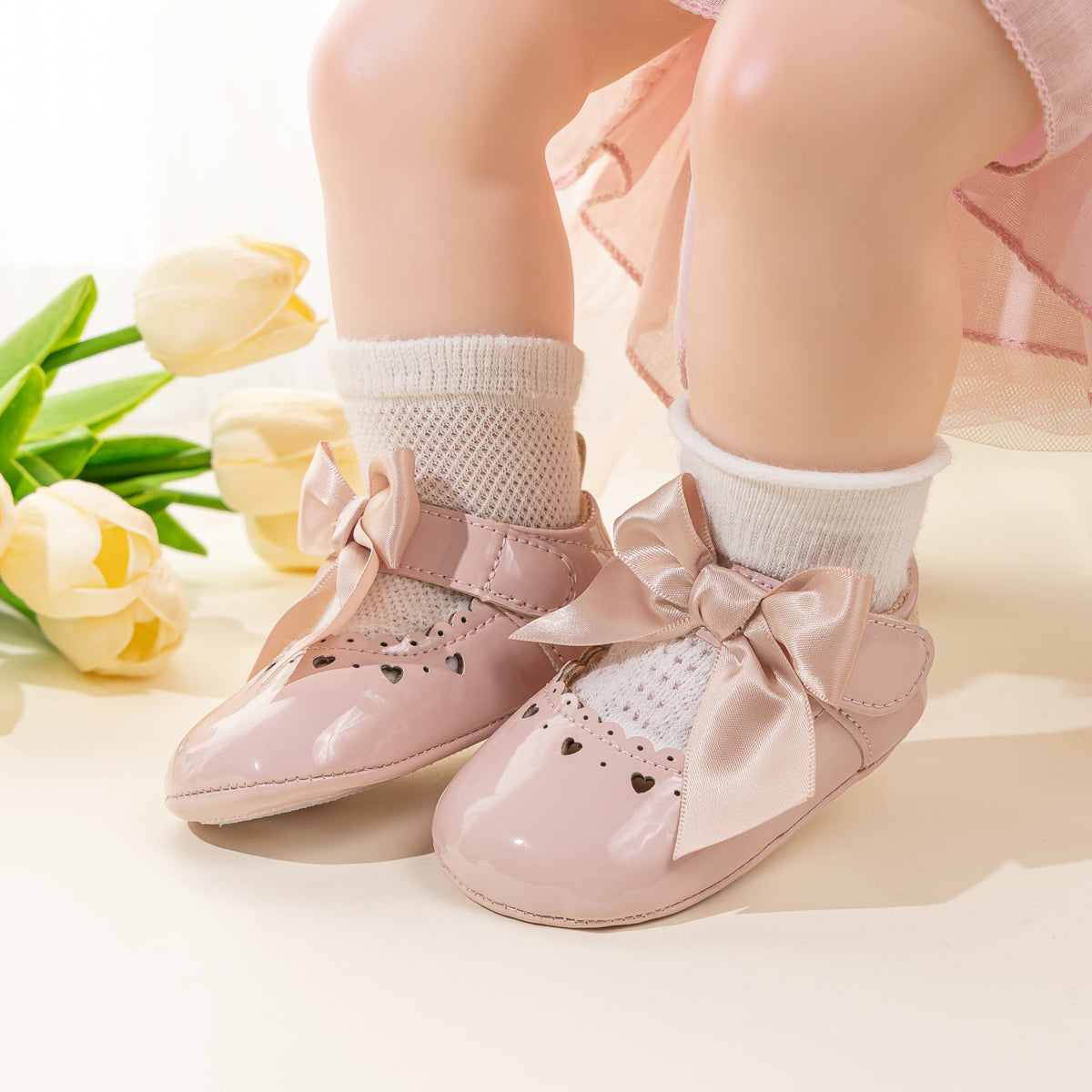 Cute heart pink front satin bow baby shoes. CG5369
