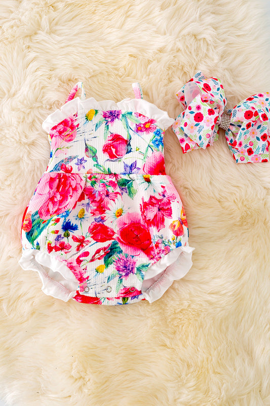 Spring floral onesie with ruffle hem.