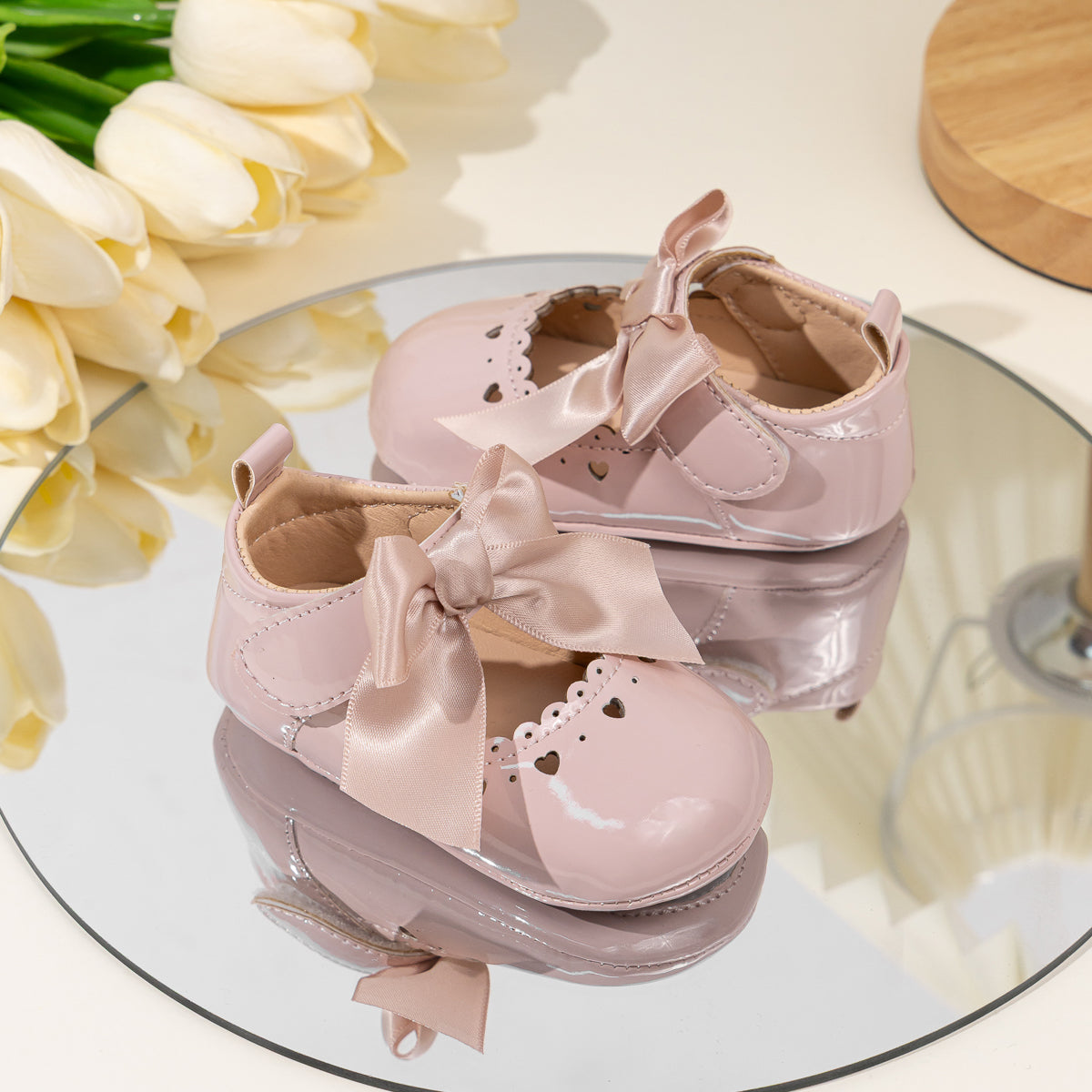 Cute heart pink front satin bow baby shoes. CG5369