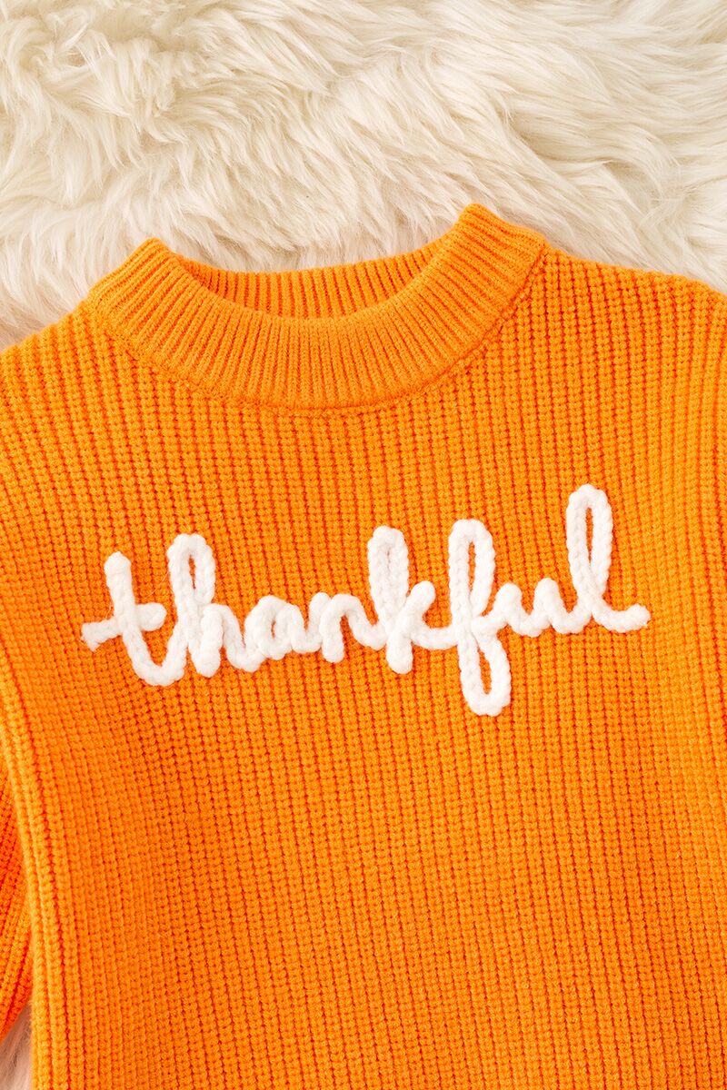 Orange Thankful knit sweater with embroidered flowers on sleeves. TPG60420 -M-
