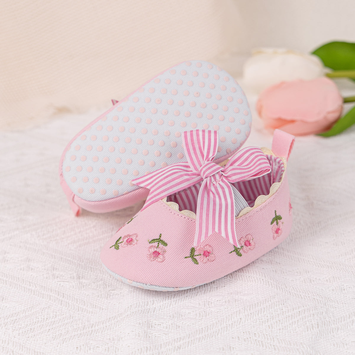Embroidered girls baby shoes with front bow.