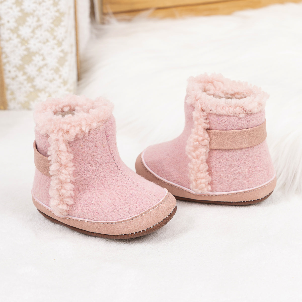 Brown faux fur baby boots. CG5402