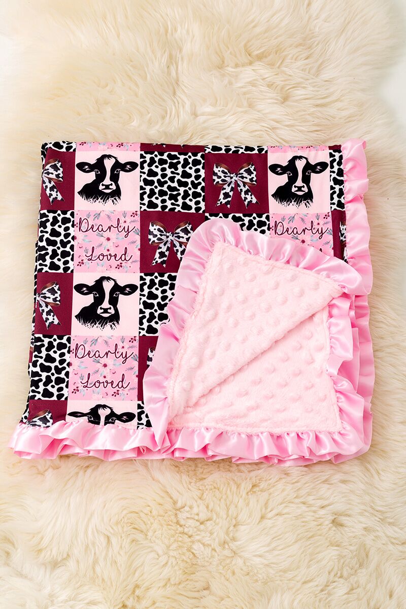 Dearly Loved multi -printed baby blanket with ruffle trim.